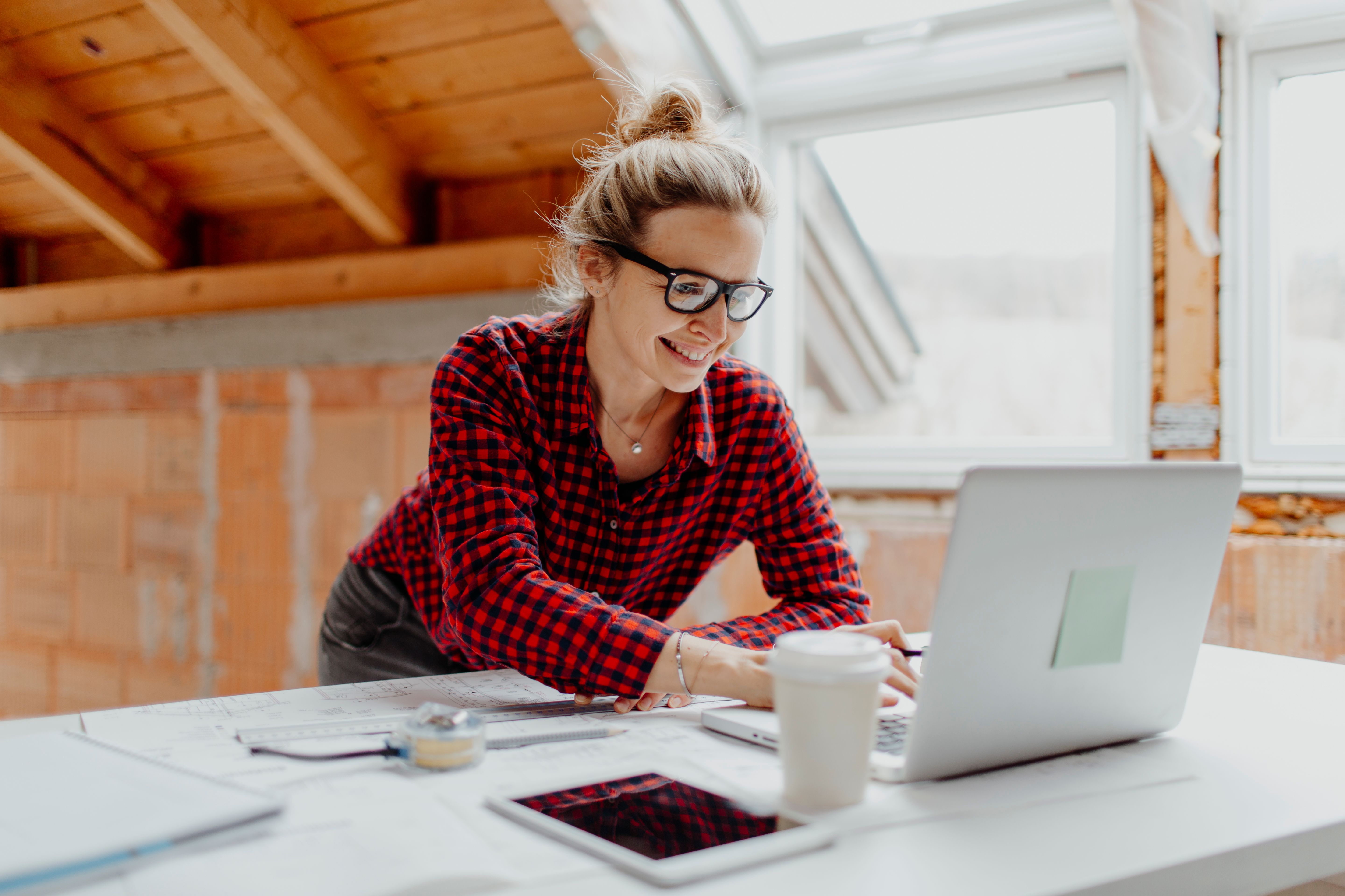 female-architect-working-desk-office.jpg