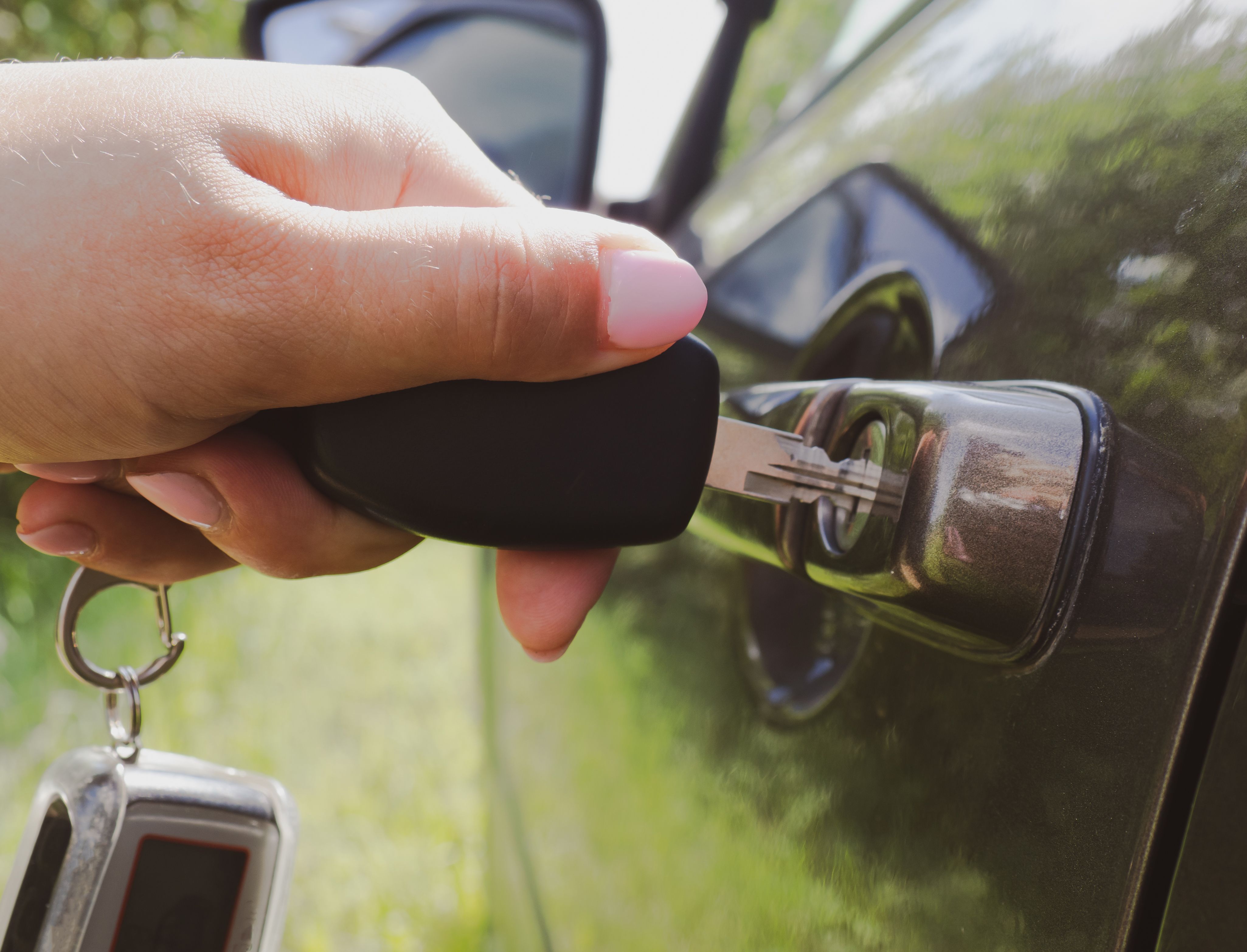 girl-opens-car-with-key-close-up.jpg