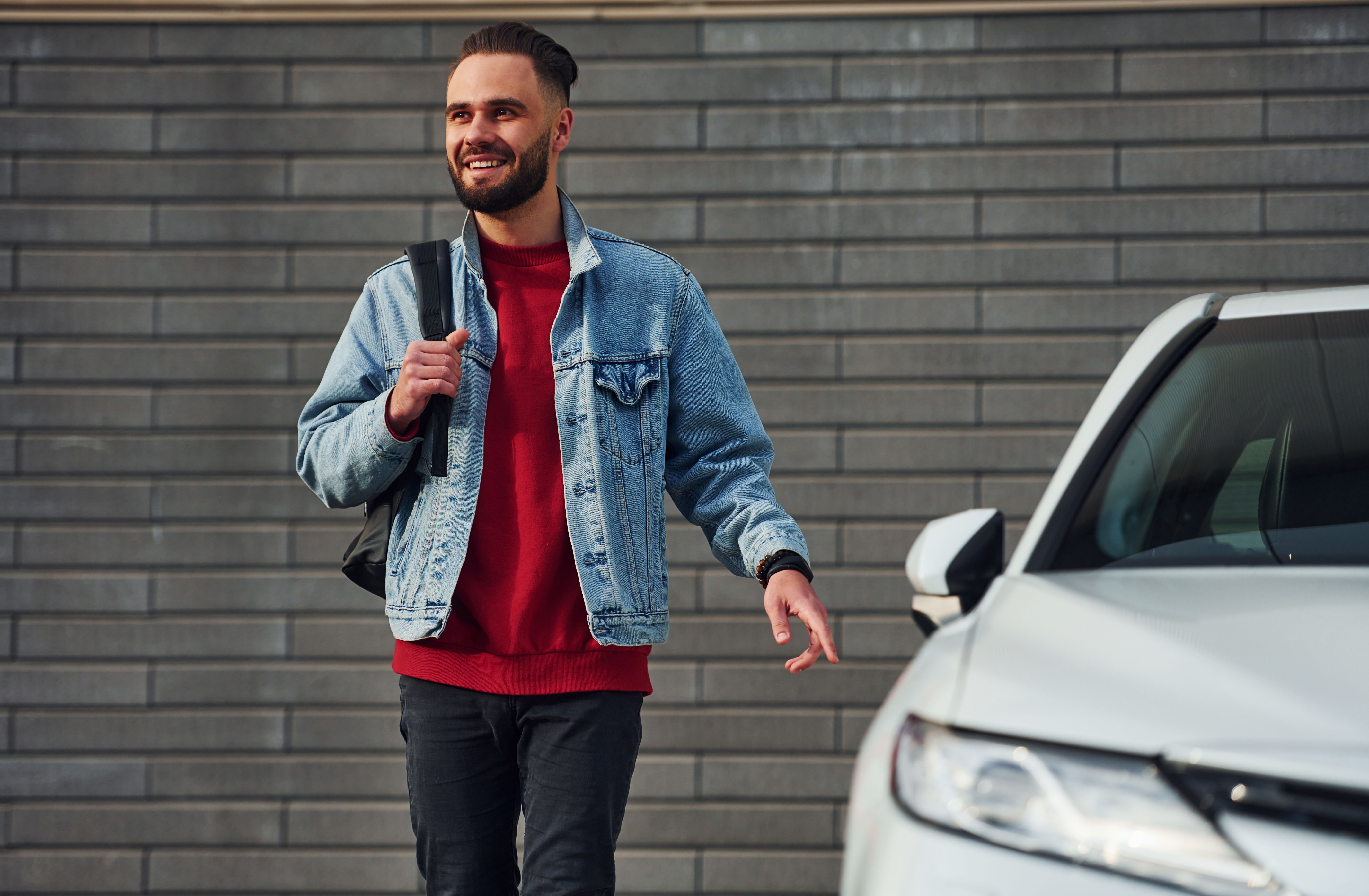 handsome-young-guy-casual-clothes-is-outdoors-sunny-daytime-near-white-car.jpg