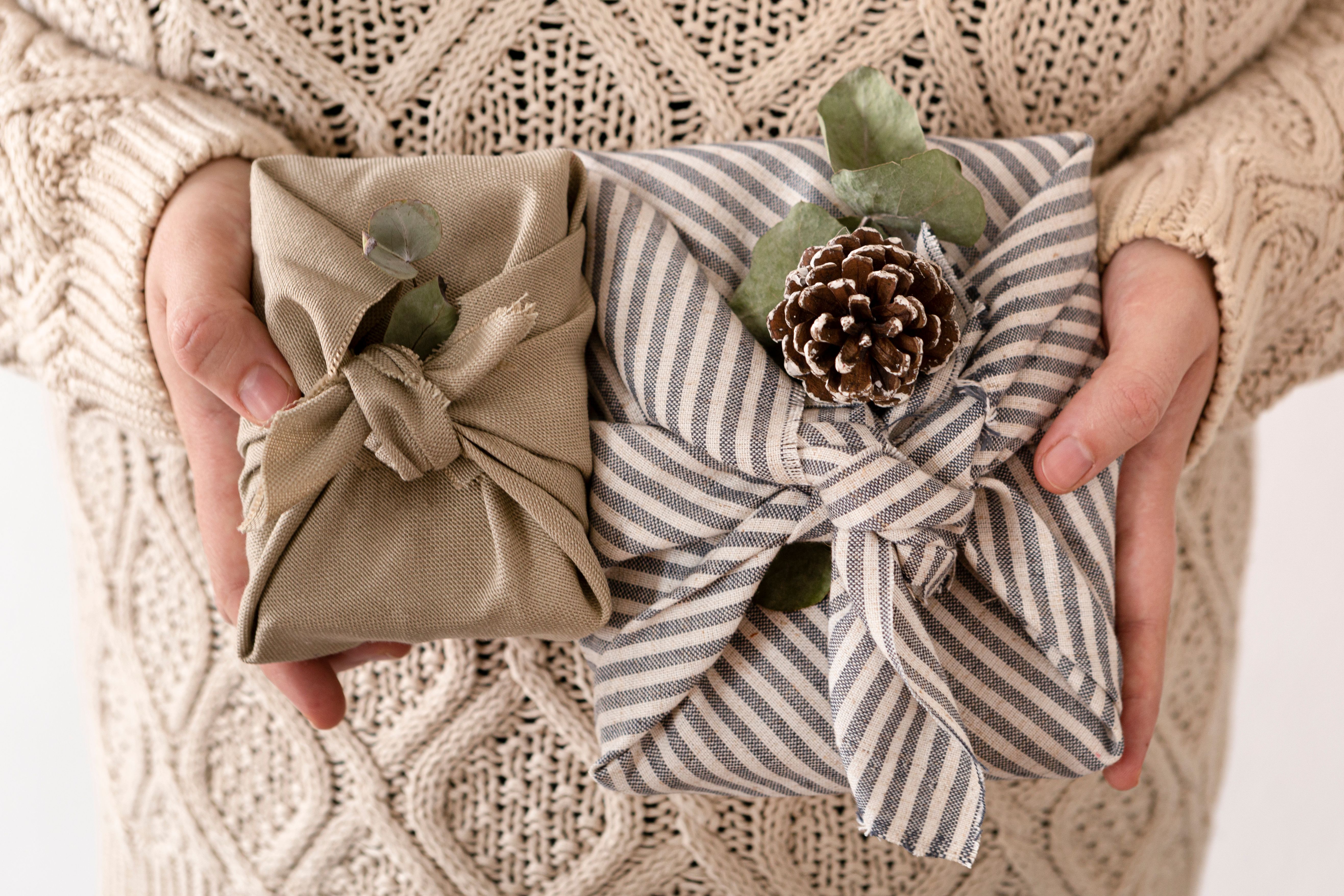 person-holding-some-wrapped-christmas-gifts.jpg